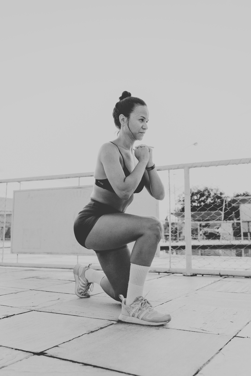 A water polo athlete performing a dryland strength exercise